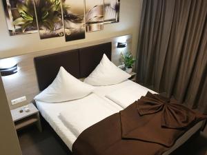 Postel nebo postele na pokoji v ubytování Hotel Glinde