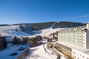 an aerial view of a hotel in the snow at Best Western Ahorn Hotel Oberwiesenthal – Adults Only in Kurort Oberwiesenthal