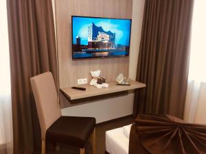 TV a/nebo společenská místnost v ubytování Hotel Glinde