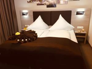 Postel nebo postele na pokoji v ubytování Hotel Glinde