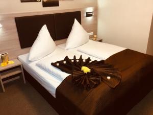 Postel nebo postele na pokoji v ubytování Hotel Glinde