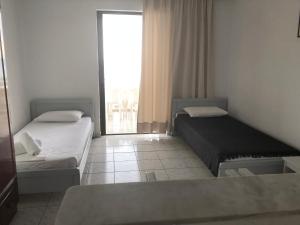 Postel nebo postele na pokoji v ubytování Diomare Villas