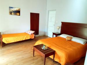 Postel nebo postele na pokoji v ubytování Bed & Breakfast Macallè