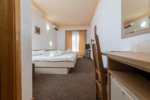 Postel nebo postele na pokoji v ubytování Hotel Ami - M