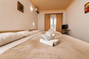 Postel nebo postele na pokoji v ubytování Hotel Ami - M