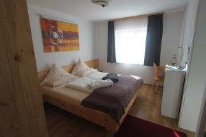 Posteľ alebo postele v izbe v ubytovaní Gästehaus Waldrand Garni