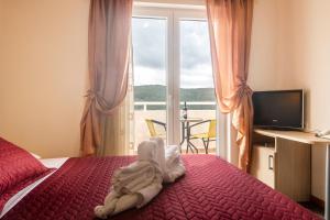 TV a/nebo společenská místnost v ubytování Hotel Ami - M + 37 fotografií