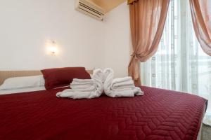 Postel nebo postele na pokoji v ubytování Hotel Ami - M