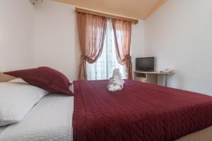Postel nebo postele na pokoji v ubytování Hotel Ami - M