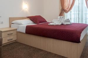 Postel nebo postele na pokoji v ubytování Hotel Ami - M