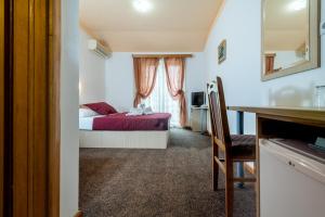 Postel nebo postele na pokoji v ubytování Hotel Ami - M