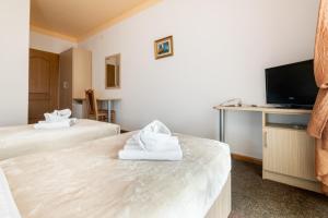 TV a/nebo společenská místnost v ubytování Hotel Ami - M