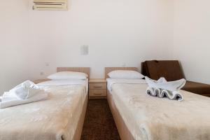 Postel nebo postele na pokoji v ubytování Hotel Ami - M