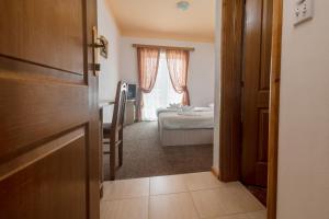 Postel nebo postele na pokoji v ubytování Hotel Ami - M
