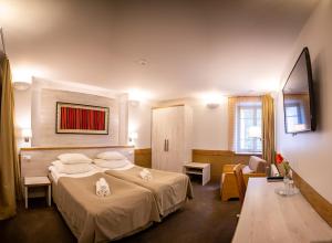 Postel nebo postele na pokoji v ubytování Hotel Liilia