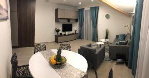 TV a/nebo společenská místnost v ubytování Tále Apartmán 9, Lúčnica, Chopok juh