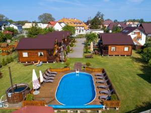 an aerial view of a resort with a swimming pool at Dom Wczasowy Laguna in Dąbki