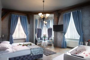 Postel nebo postele na pokoji v ubytování Hotel Urania