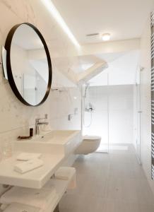a bathroom with a sink and a mirror at Hotel Gradska Cetinje in Cetinje