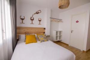 Postel nebo postele na pokoji v ubytování Tinto Dreams Hostel