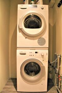 a washer and dryer in a room at Flat appartement 7 min from Paris Orly in Choisy-le-Roi
