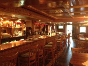 a bar in a restaurant with a lot of chairs at Glendine Inn in Kilkenny