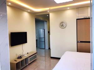 TV i/ili multimedijalni sistem u objektu Utopia Apartment