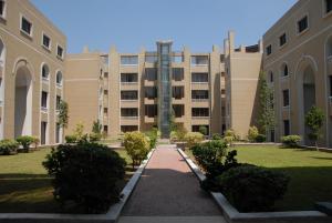 a large building with a courtyard in front of it at Avari Xpress, Islamabad in Rawalpindi