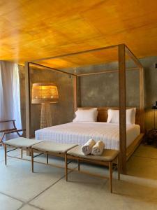 A bed or beds in a room at Pedras Do Patacho Hotel Boutique Experience