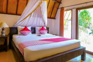 A bed or beds in a room at Nelly homestay