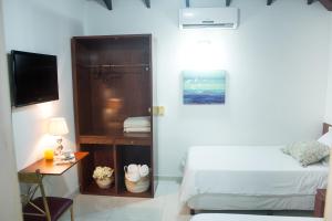 Postel nebo postele na pokoji v ubytování Beulah Hotel Boutique + 11 fotografií
