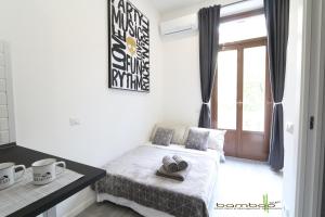Letto o letti in una camera di Bamboo Milano Lomellina Apartment