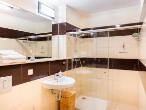Koupelna v ubytování VacationClub – Olympic Park Apartament A106
