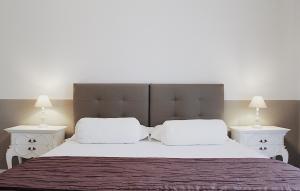 Postel nebo postele na pokoji v ubytování CasaMamy Pompei