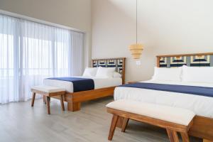 Postel nebo postele na pokoji v ubytování Lapazul Boutique Hotel + 37 fotografií