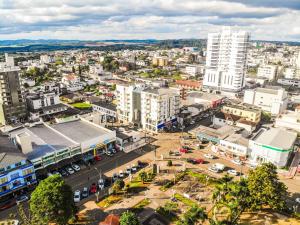 an aerial view of a city with buildings at Bebber Hotel in Campos Novos