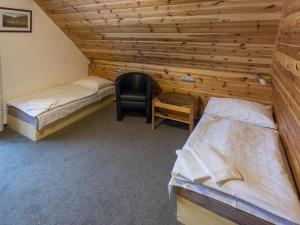 Postel nebo postele na pokoji v ubytování EA Horský Hotel Hájenka