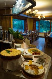 a table with many different types of food on it at Petrohue Lodge in Petrohué