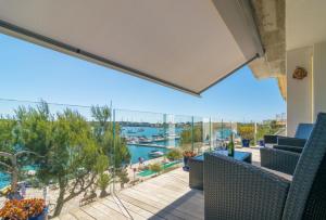 a balcony with a view of the water at Llevant in Portocolom