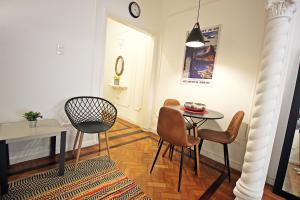 a small dining room with a table and chairs at Rio Spot Homes vintage C051 in Rio de Janeiro