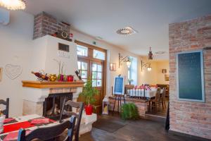 a living room with a fireplace and a dining room at Villa Parma in Maribor Self check - in in Maribor +32 photos