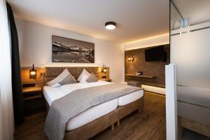 Postel nebo postele na pokoji v ubytování Hotel Brugger