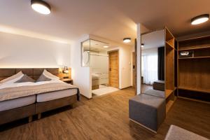 Postel nebo postele na pokoji v ubytování Hotel Brugger