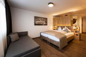 Postel nebo postele na pokoji v ubytování Hotel Brugger