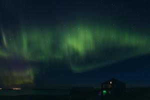 an image of the northern lights in the sky at Drangar Country Guesthouse in Drangar