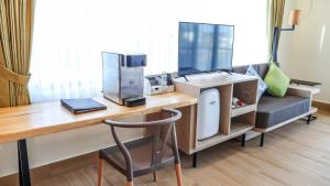 a room with a desk with a coffee maker at Sea Passion Hotel in Koror