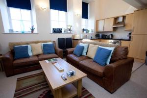 a living room with two couches and a coffee table at Ardnave in Port Charlotte