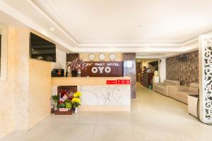 a lobby of a hotel with a sign that reads oxo at Hung Phat Hotel - Trung Son in Ho Chi Minh City