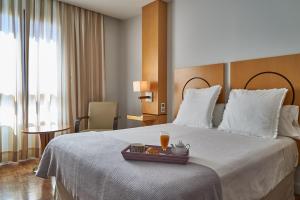 Posteľ alebo postele v izbe v ubytovaní Hotel Don Curro