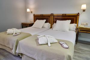 Posteľ alebo postele v izbe v ubytovaní Hotel Don Curro
